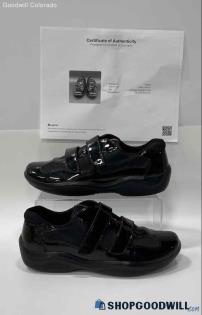 Original auction photo of black Prada-labelled patent sneakers beside a certificate